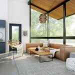 living room with brown sofa and glass window